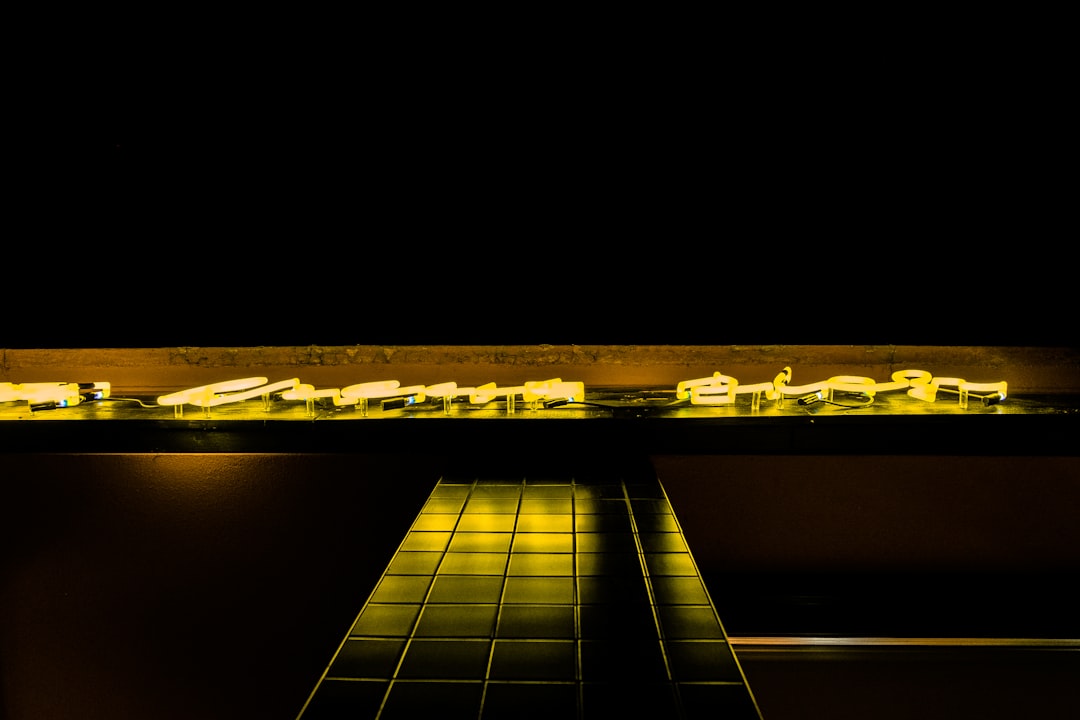 A detailed architectural model of a city neighborhood with glowing lights, representing data-driven insights and hyperlocal SEO in real estate.