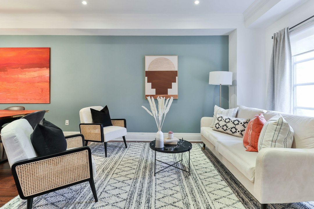 A bright, modern living room serves as an example of a comfortable and energy-efficient home environment, the primary benefit of quality insulation.